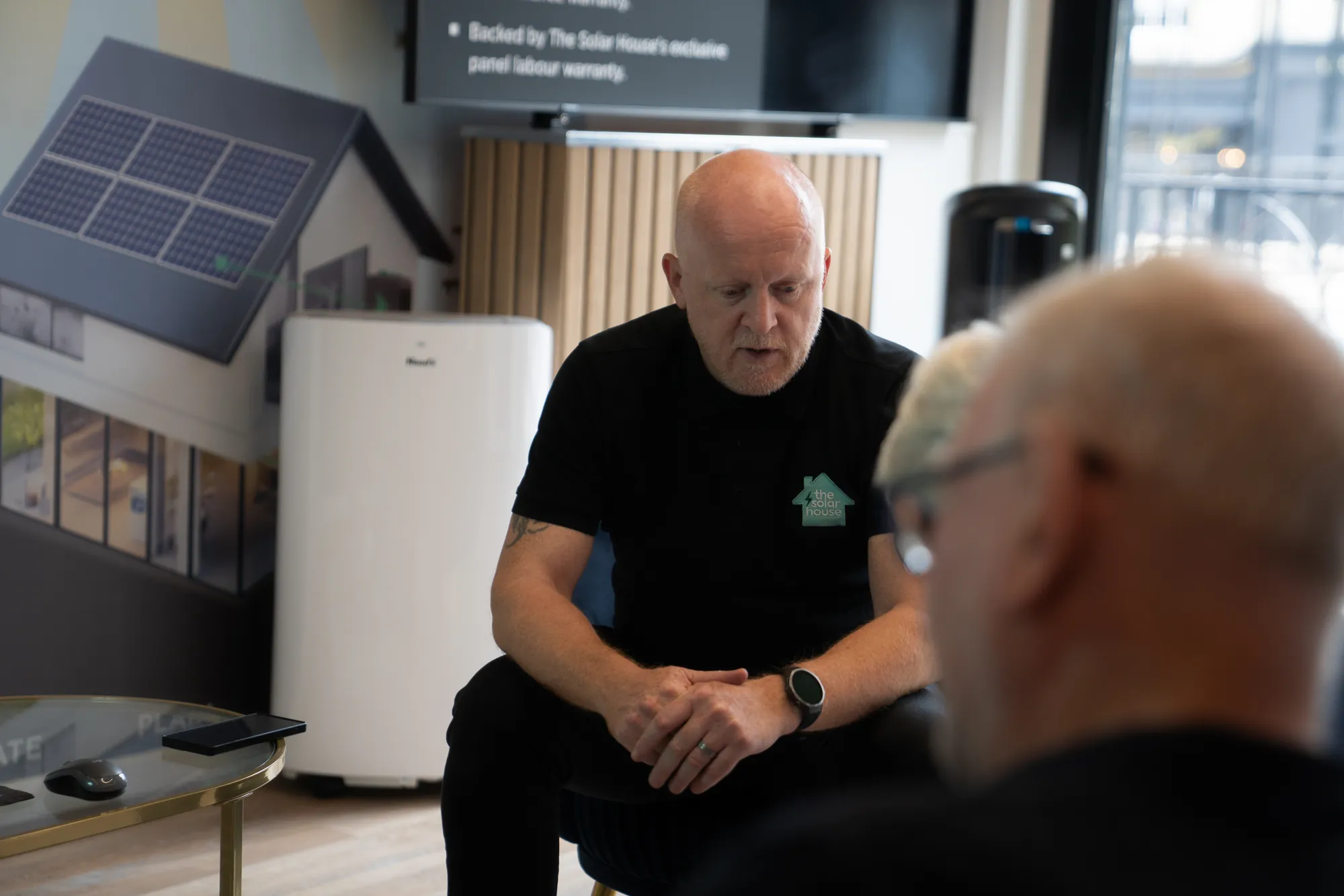 One of our team talking a customer through their options in the showroom