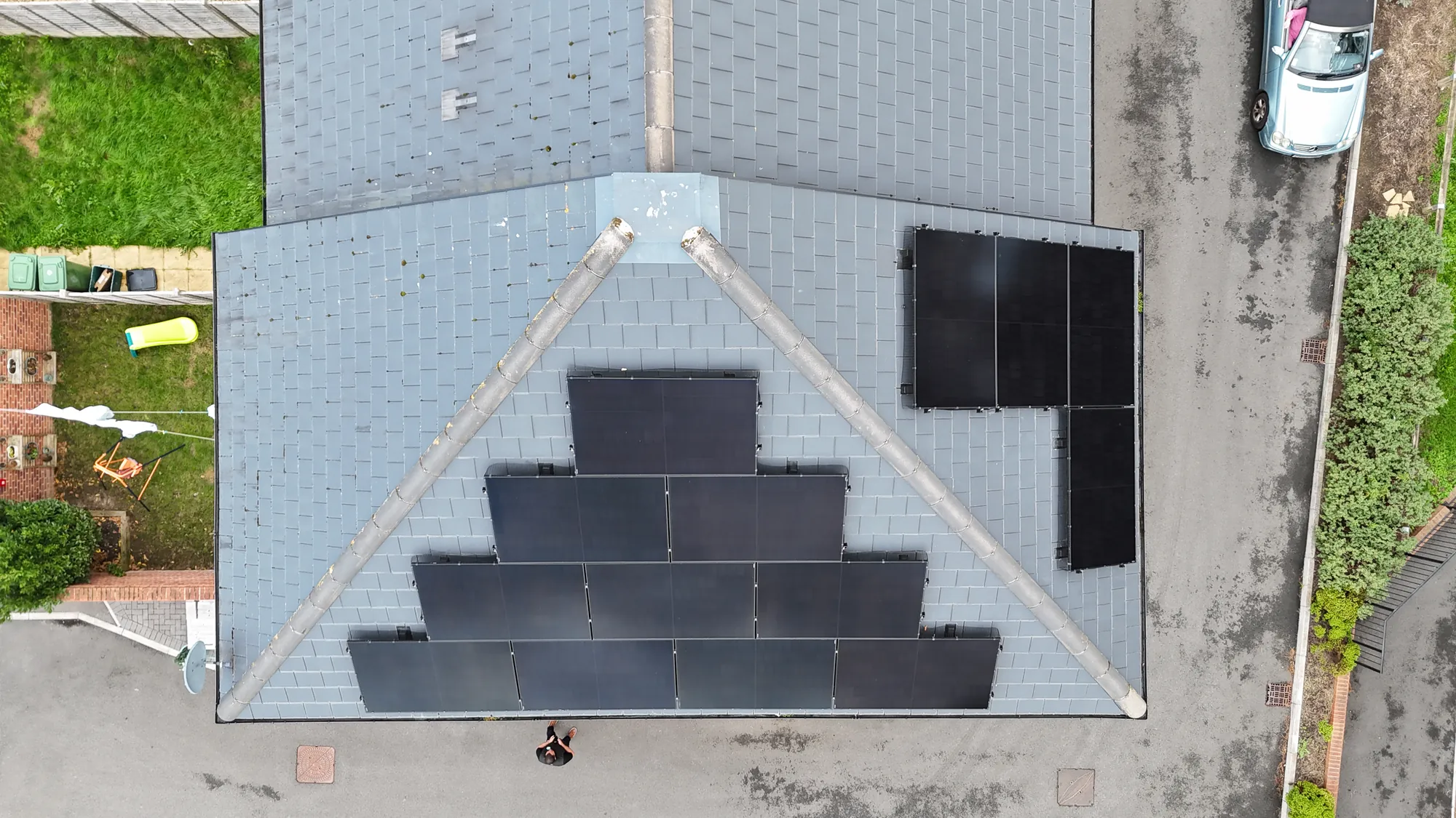 Looking down on the roof from above, with panels on the main roof and side roof