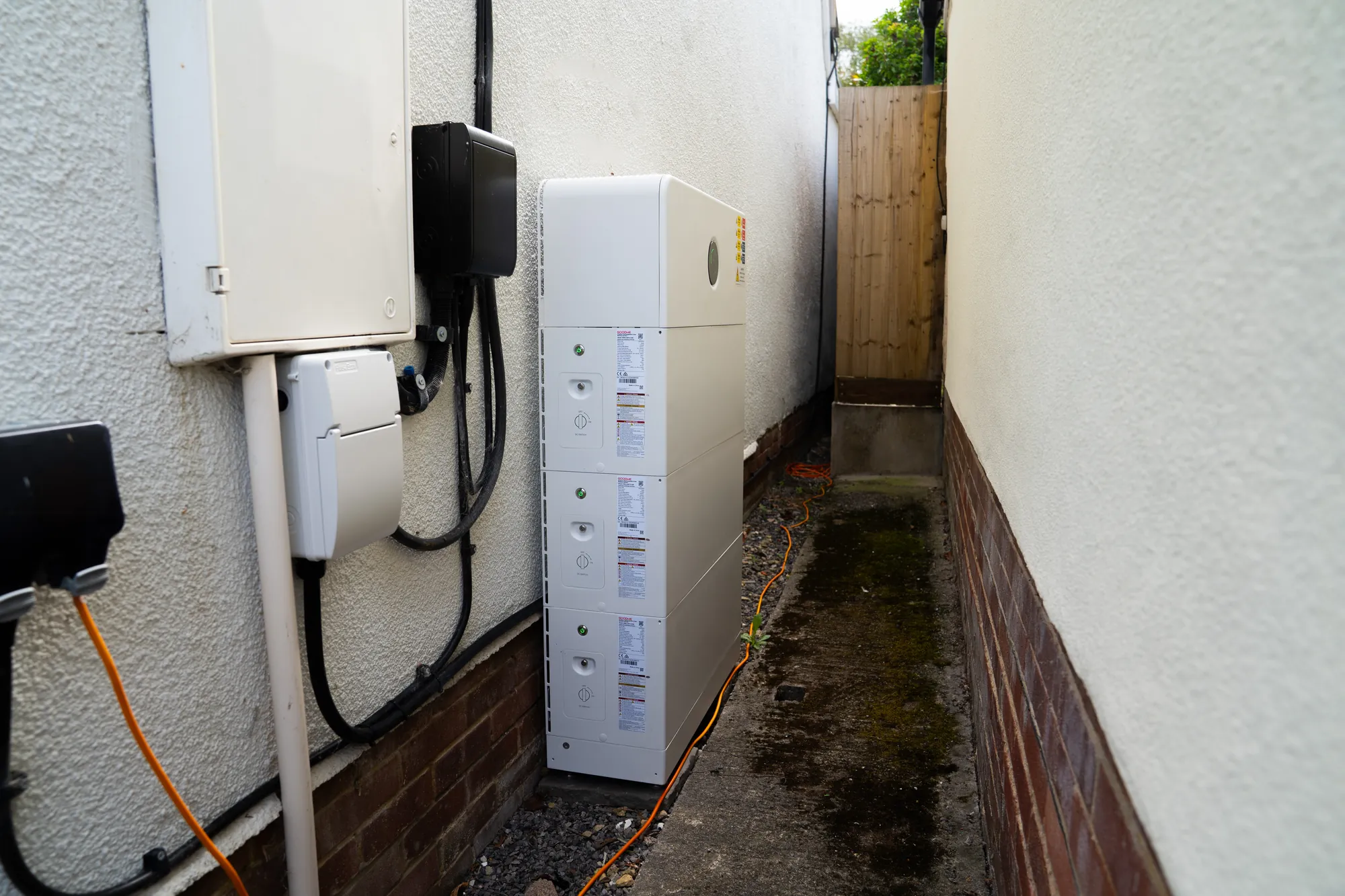 The GoodWe battery stack and inverter at the side of the house