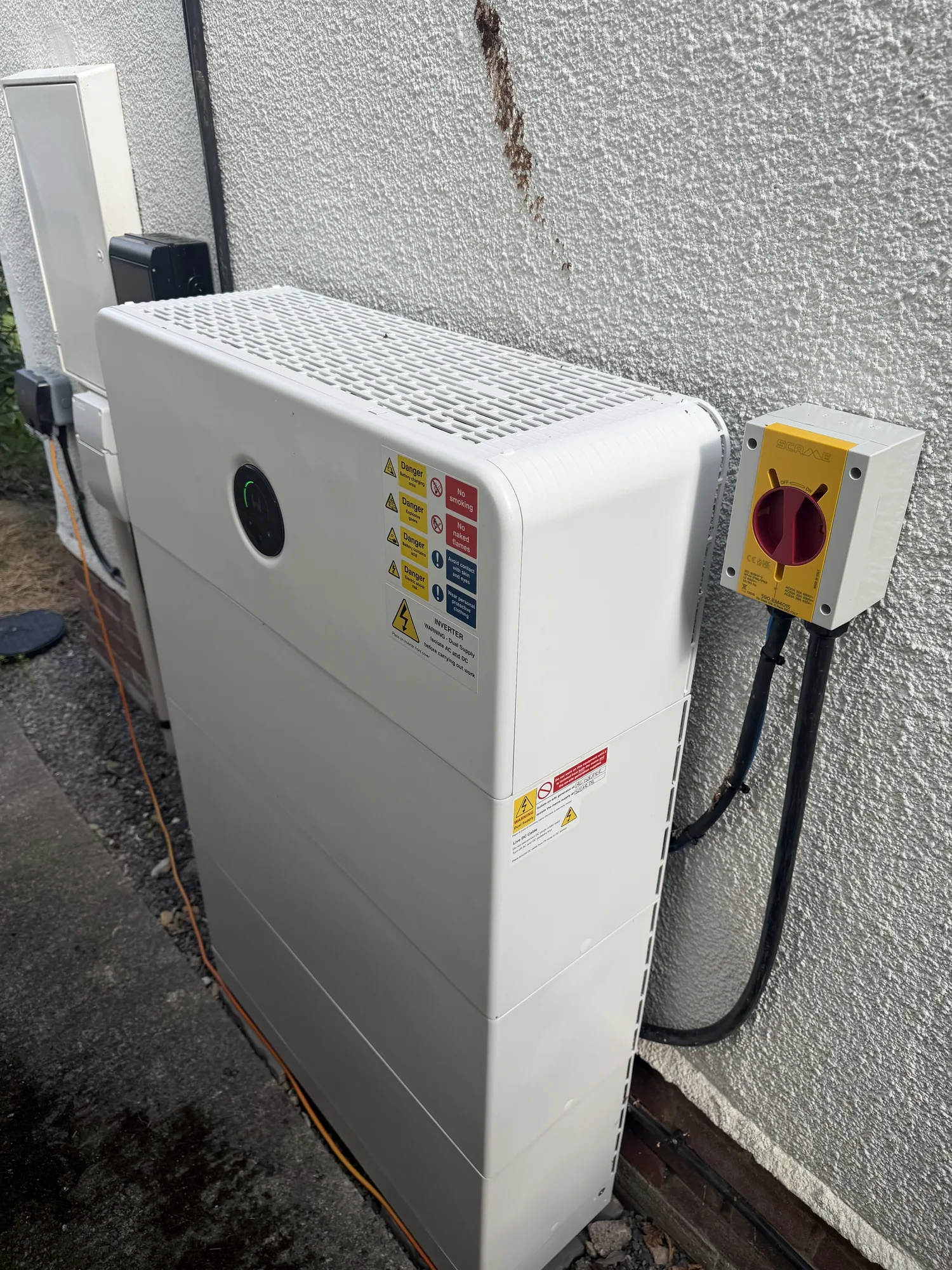 The GoodWe battery and isolator on the side wall