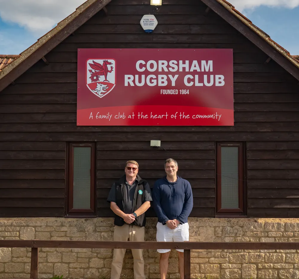 Two of The Solar House team outside Corsham Rugby Club, a club we support