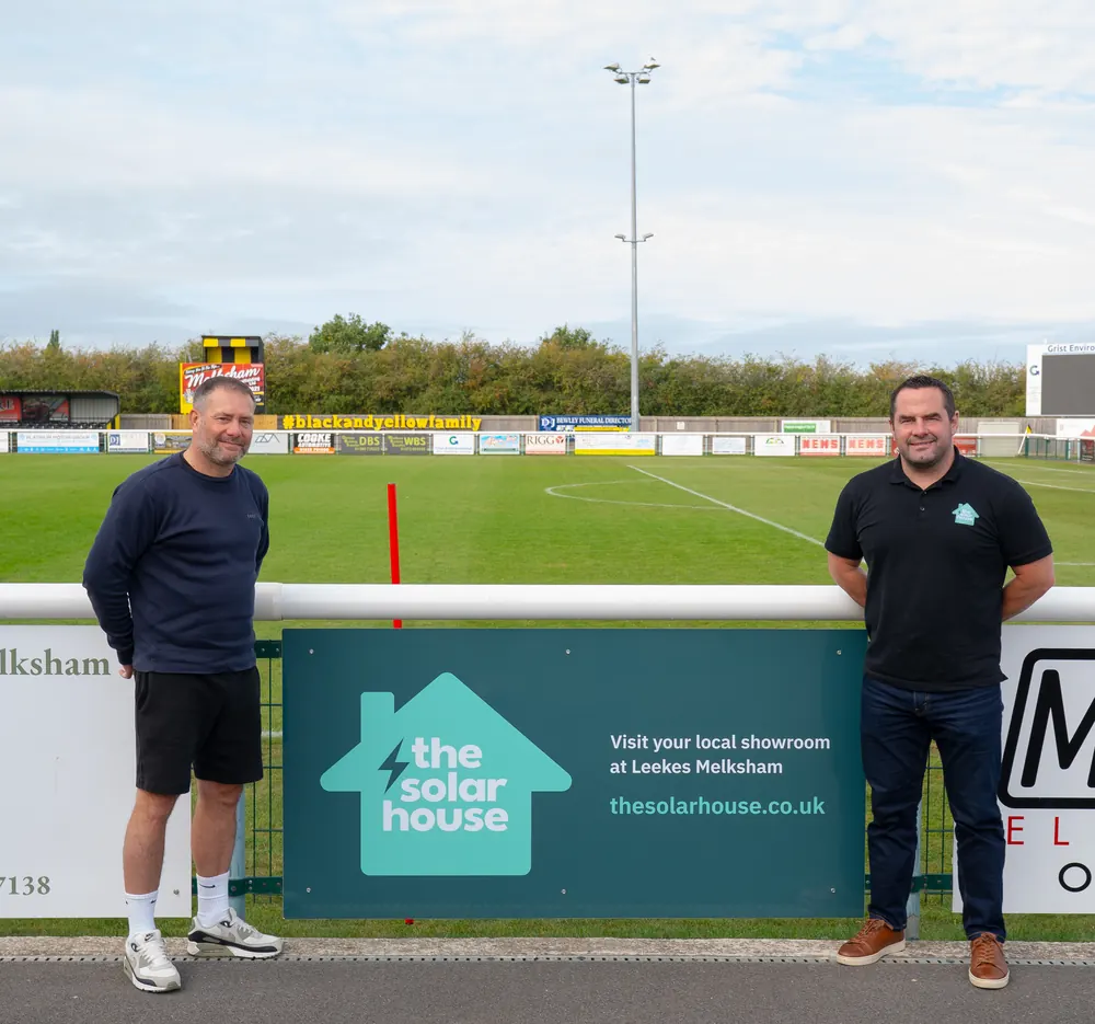 The Solar House team by our pitch-side banner at a local club