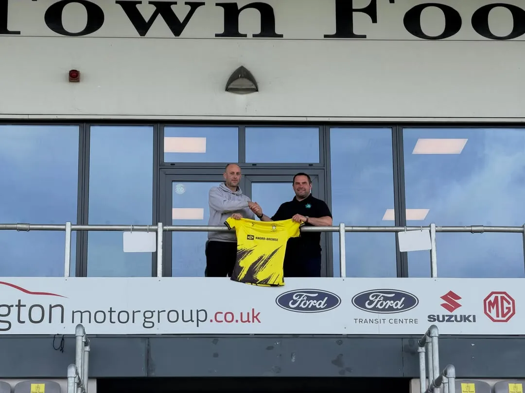 The Solar House banner in the stand at Melksham Town FC