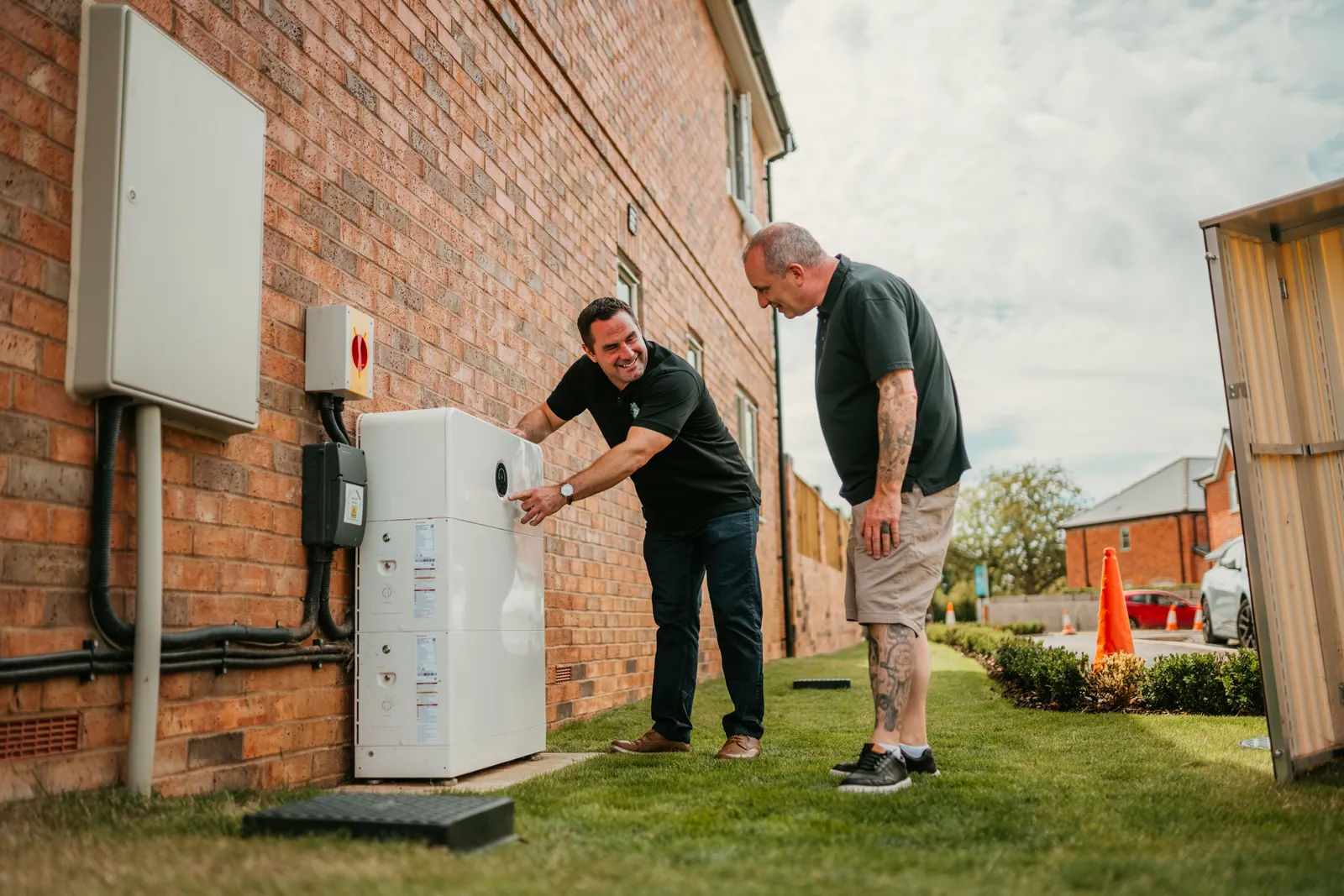 One of our team explaining a newly fitted home battery to the homeowner